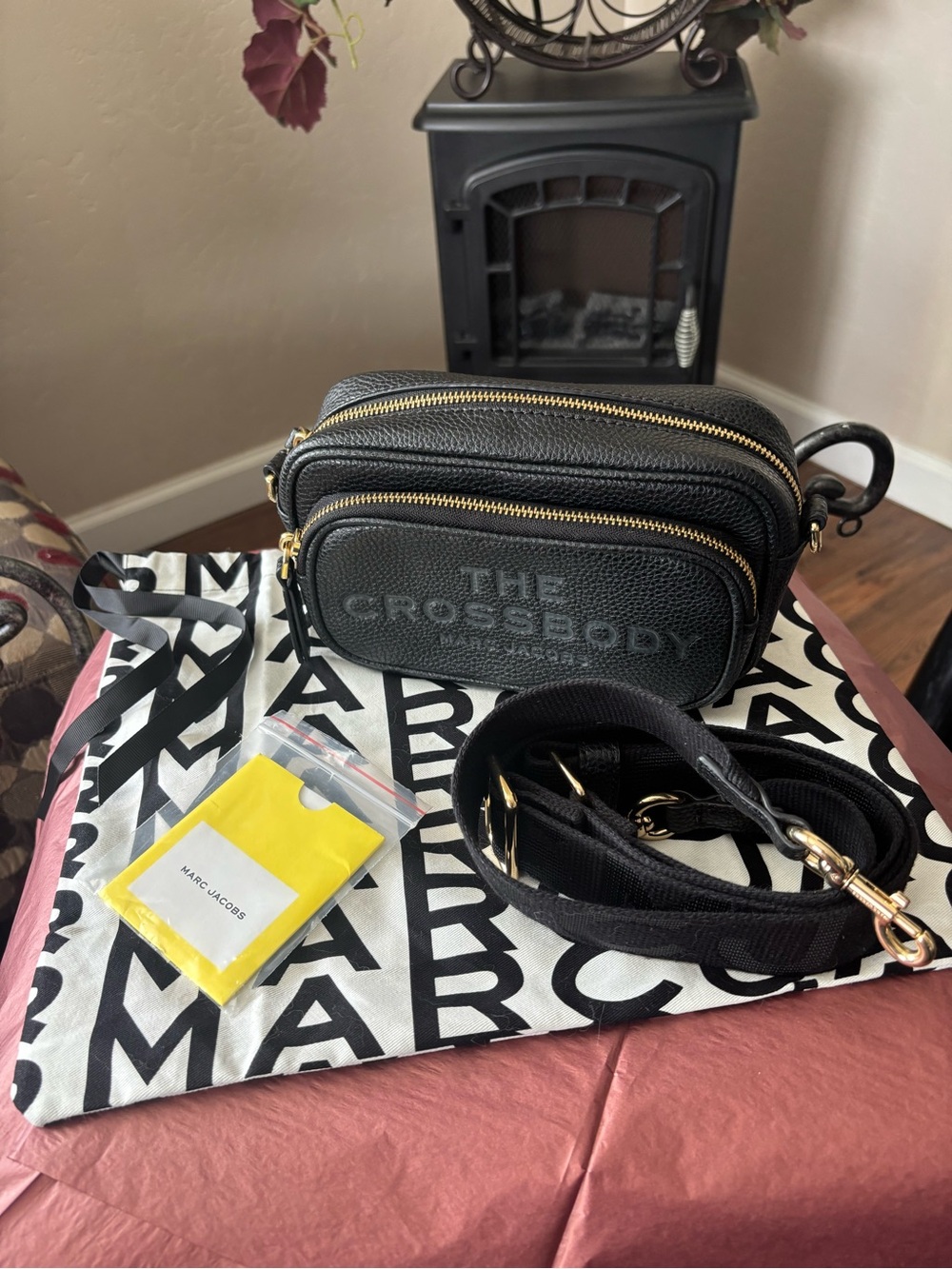 The Crossbody Black Leather Crossbody Bag with Gold Zippers